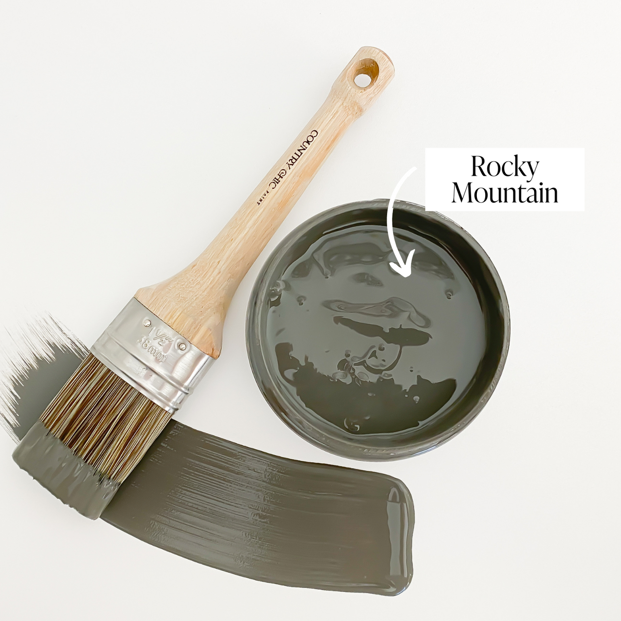 Top view of an open 16oz jar of Country Chic Chalk Style All-In-One Paint in the color Rocky Mountain. Charcoal grey.